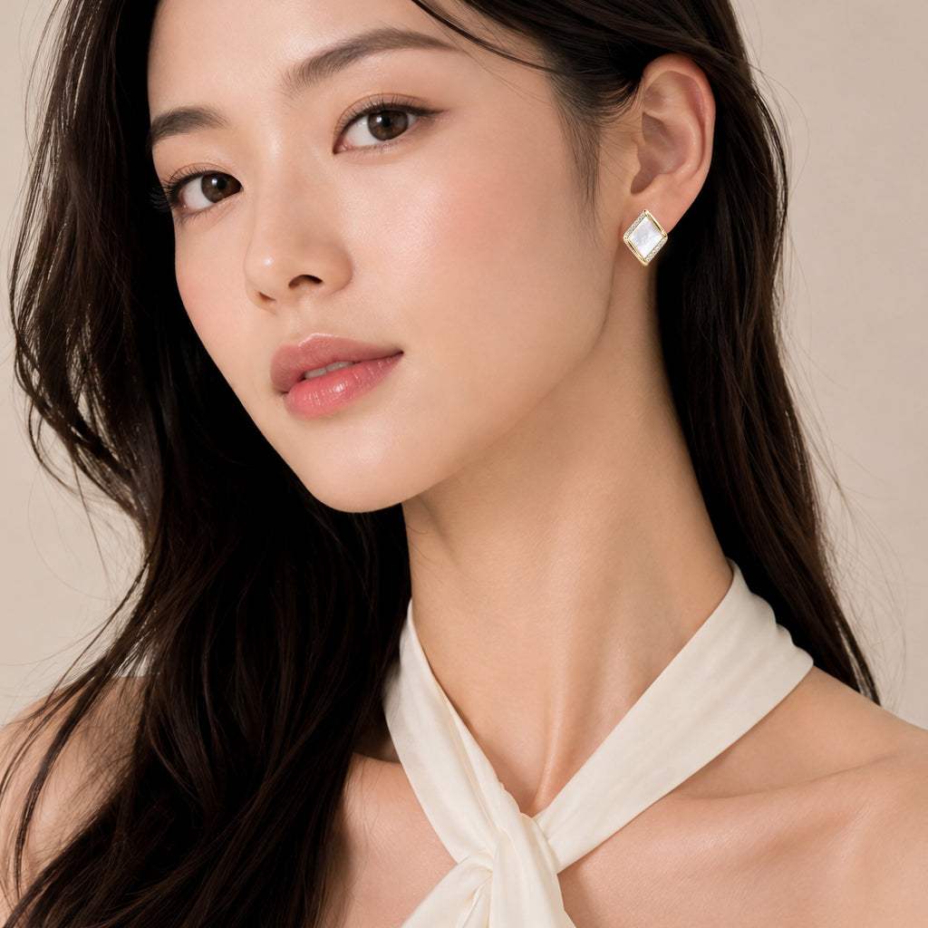 Mother of Pearl earrings with cubic zirconia rim gold plated studs