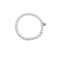 Freshwater Pearl Bracelet with 6-7mm roundish pearls on elastic band for easy wear, classic style.