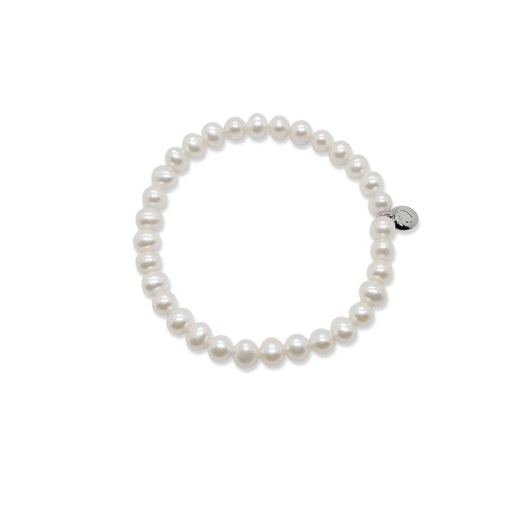 Freshwater Pearl Bracelet with 6-7mm roundish pearls on elastic band for easy wear, classic style.