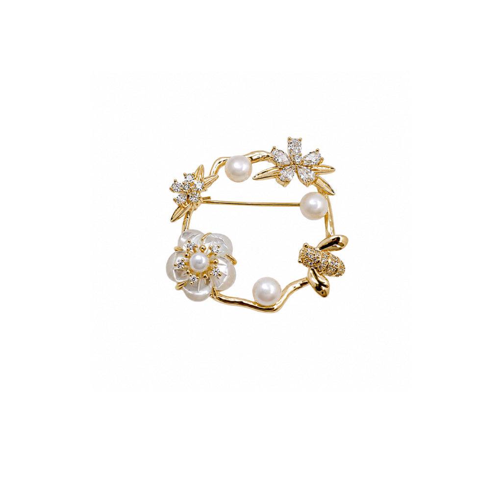 Flower mother of pearl brooch with freshwater pearl and cubic zirconia