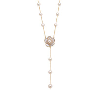 Elegant simulated pearl necklace with white enamel flower pendant on gold-plated chain