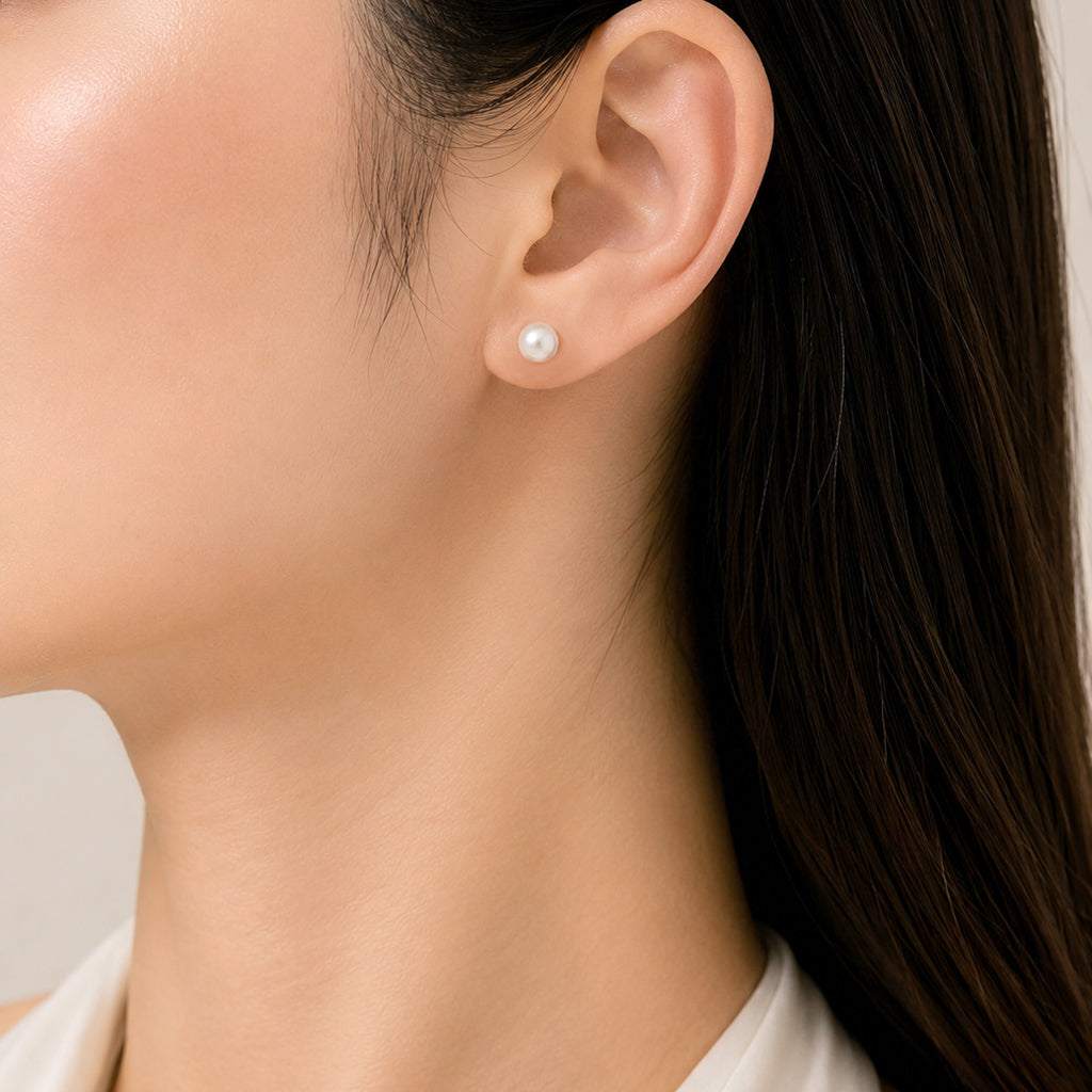 Simulated pearl 6mm round stud earring with rhodium plated post backing