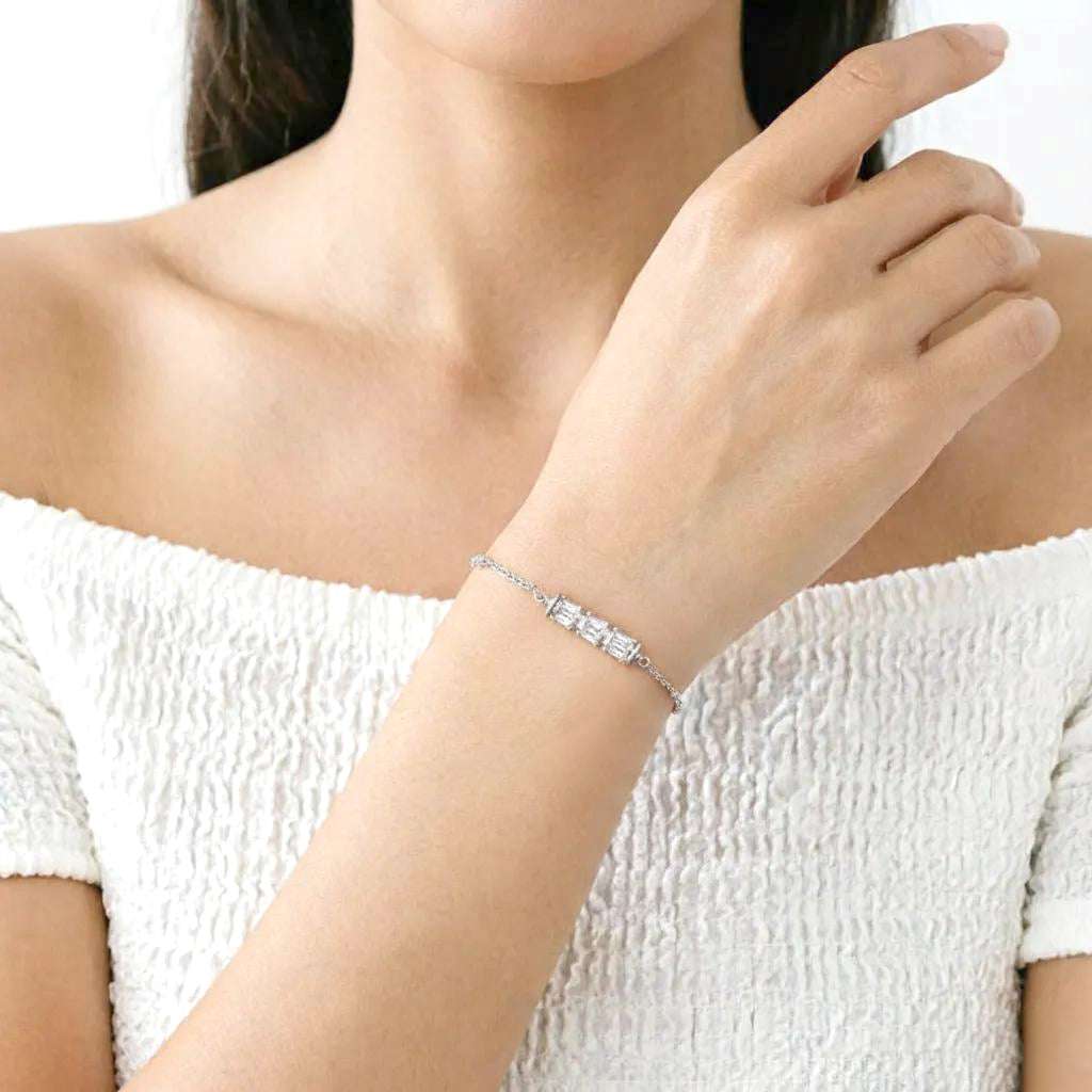 Elegant rhodium-plated cubic zirconia bracelet with roundels and rectangular stones on adjustable chain