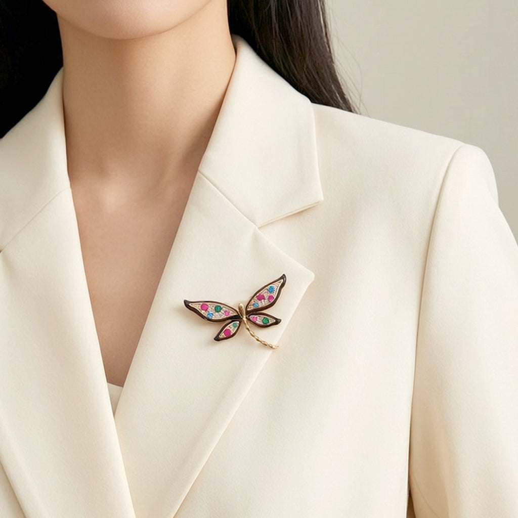 Dragonfly cubic zirconia brooch with coloured stones and black enamel outline, gold plated finish, 4.5cm by 2.8cm size