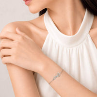 Elegant rhodium plated ribbon cubic zirconia bracelet with adjustable chain and spring clasp