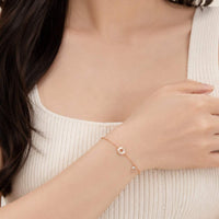 Round mother of pearl bracelet with cubic zirconia and rosegold plating, adjustable length