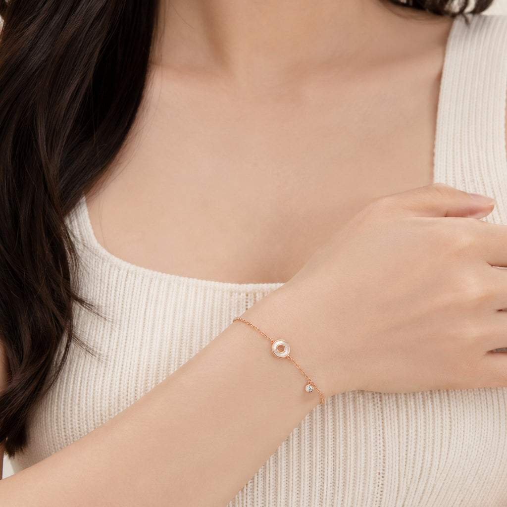 Round mother of pearl bracelet with cubic zirconia and rosegold plating, adjustable length