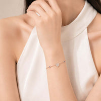 Rosegold plated heart cubic zirconia bracelet with evil eye charms and adjustable chain