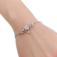 Elegant flower bracelet with mother of pearl and cubic zirconia accents on adjustable rhodium-plated chain