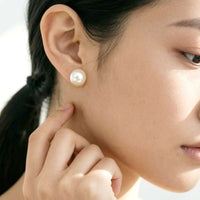 Freshwater pearl button earrings with rhodium plating and butterfly post backing