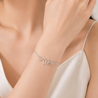Butterfly cubic zirconia bracelet with rhodium plating and adjustable chain featuring three detailed butterfly charms