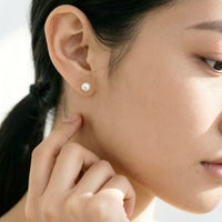 Freshwater Pearl Button Earrings with rhodium plated finish and butterfly post backing, classic 4-5mm stud design