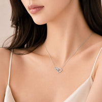 Heart interlocking cubic zirconia necklace with rhodium plated finish and adjustable chain