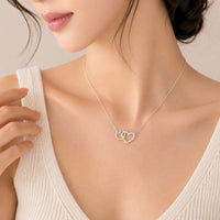 Heart cubic zirconia necklace with interlocking heart pendant and rhodium plating