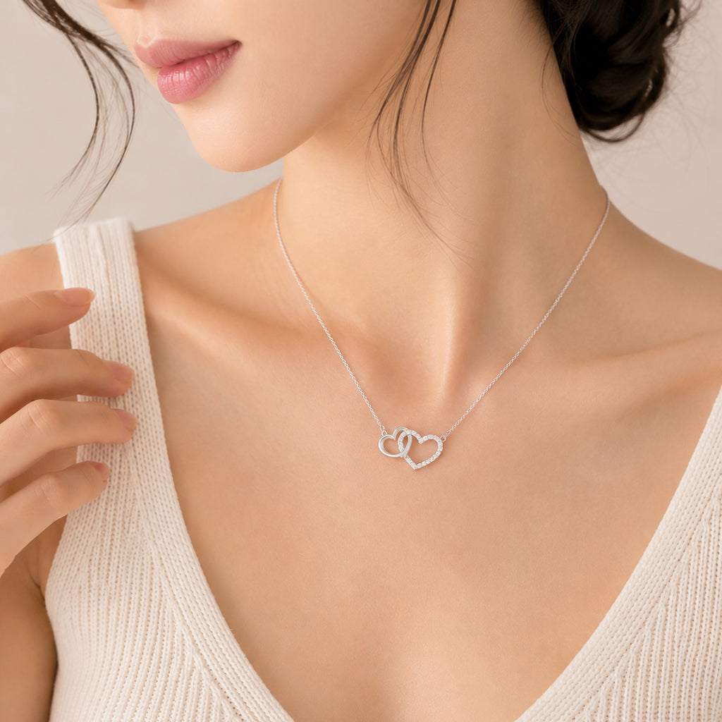 Heart cubic zirconia necklace with interlocking heart pendant and rhodium plating