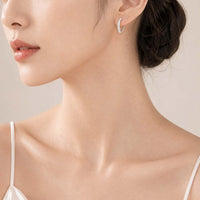 Heart cubic zirconia hoop earrings with rhodium plating and hinged clasps, 1.5cm x 1.2cm size