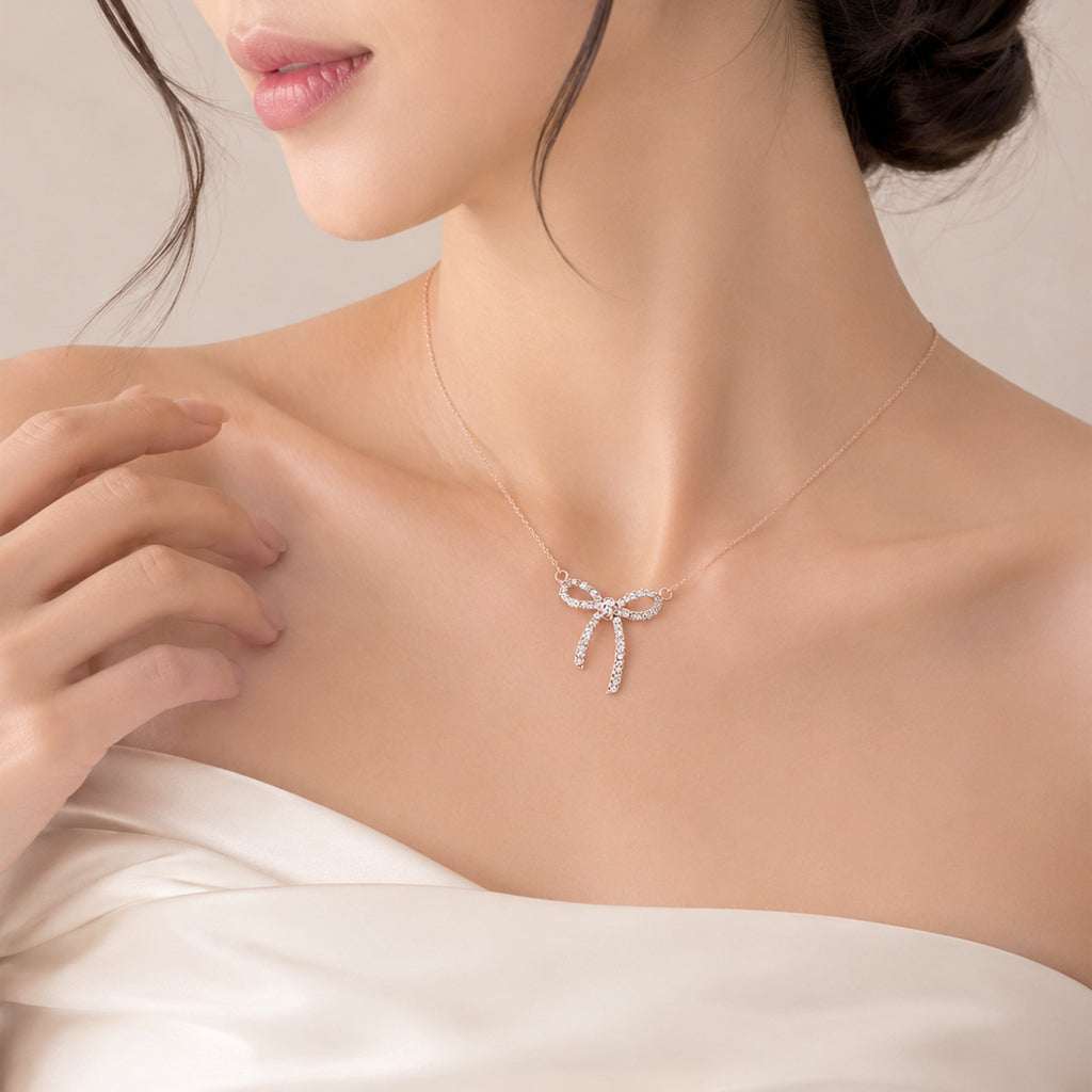 Rose gold ribbon cubic zirconia pendant necklace with adjustable chain, elegant sparkling jewelry accessory
