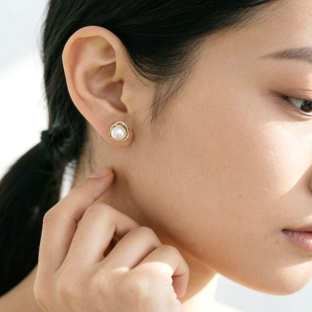 Freshwater pearl earrings with gold rim and silver detailing, 6mm button shaped pearls, 9mm diameter, gold plated stud style