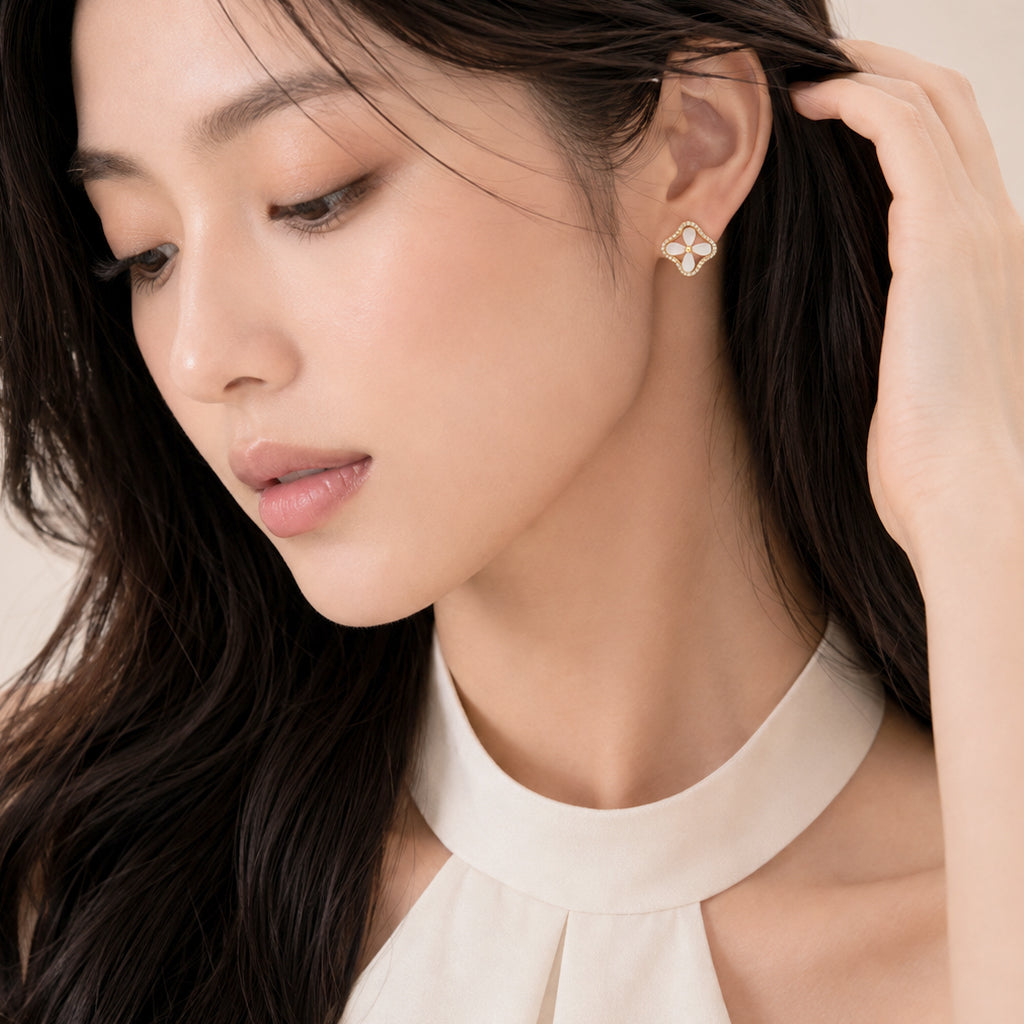 Gold plated flower simulated moonstone earrings with cubic zirconia rim stud design