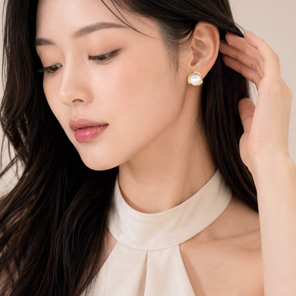 Simulated moonstone earrings with gold-plated swirls and hypoallergenic posts