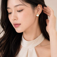 Simulated moonstone earrings with gold-plated swirls and hypoallergenic posts