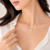 Delicate ginkgo leaf cubic zirconia necklace with rhodium plated finish and adjustable chain