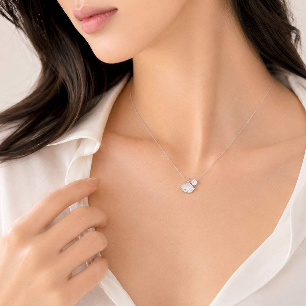 Delicate ginkgo leaf cubic zirconia necklace with rhodium plated finish and adjustable chain