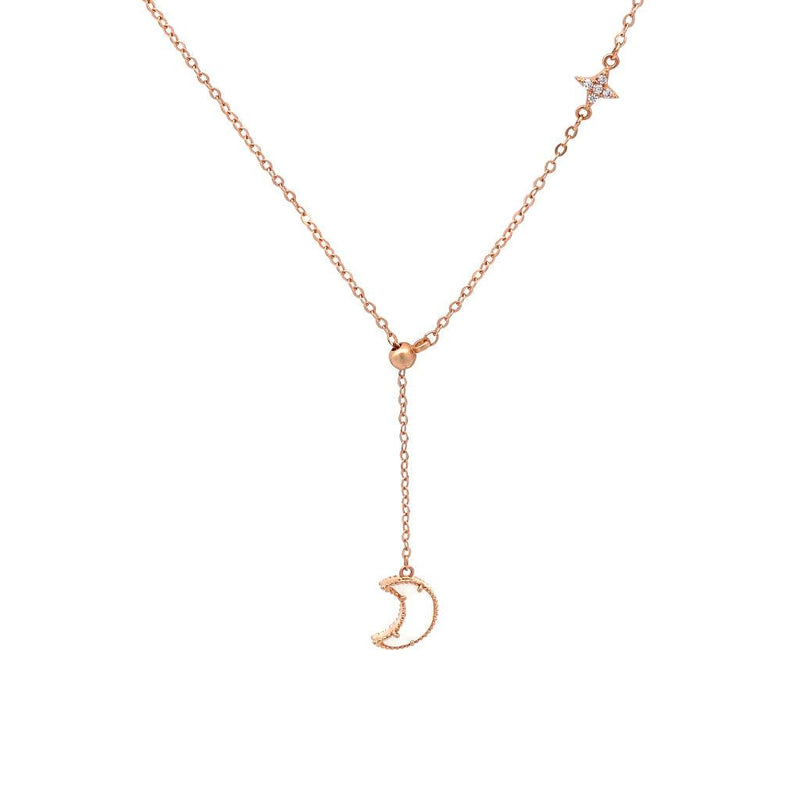 A delicate rose gold Y-necklace featuring a small crescent moon pendant, a tiny star charm set with cubic zirconia.