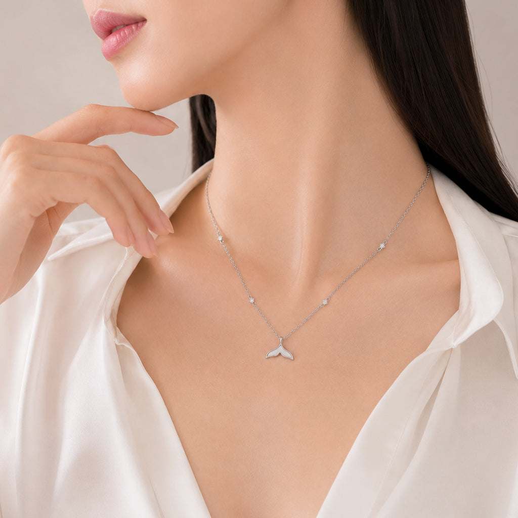 Mermaid tail necklace with mother of pearl pendant and cubic zirconia stones on adjustable rhodium plated chain