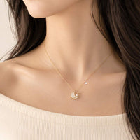 Planet cubic zirconia necklace with star accent and rosegold plated chain