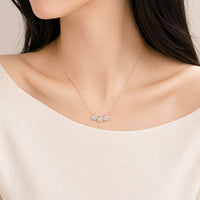 Rose gold cubic zirconia necklace with three moveable round solitaire pendants on fine adjustable chain