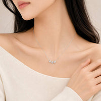 Elegant cubic zirconia necklace with three moveable round solitaire pendants on a fine rhodium plated chain