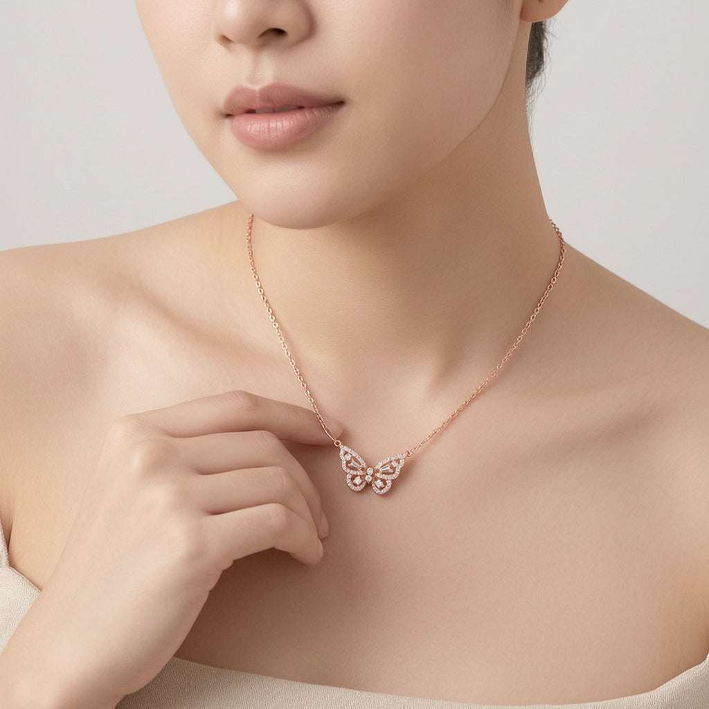 Delicate butterfly cubic zirconia pendant on rosegold chain necklace with spring clasp.