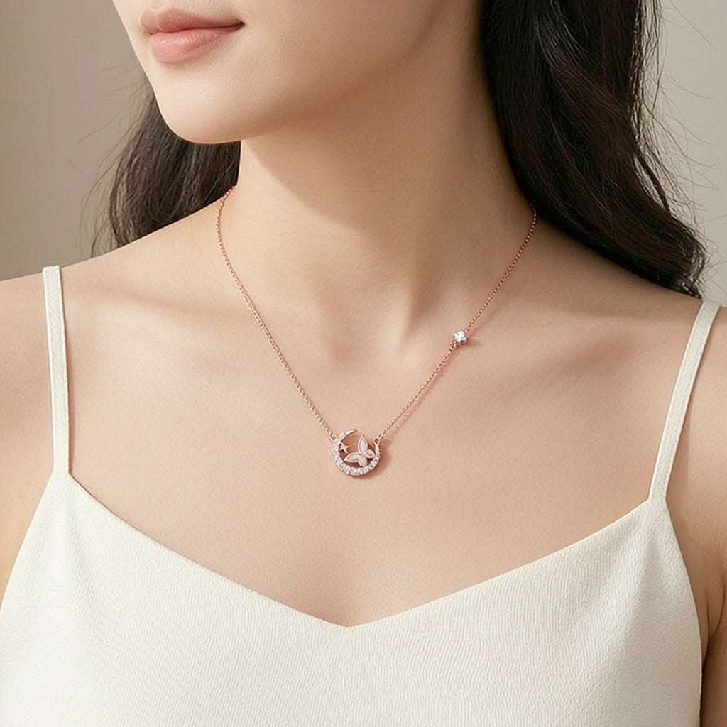 Moon and butterfly necklace with cubic zirconia and mother of pearl pendant in rosegold finish