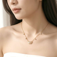 Gold-plated double heart cubic zirconia and mother of pearl necklace on delicate chain