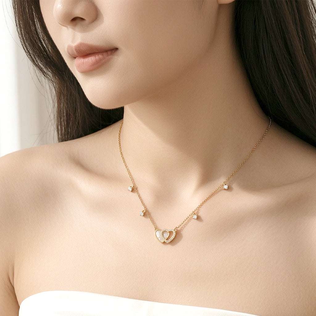Gold-plated double heart cubic zirconia and mother of pearl necklace on delicate chain