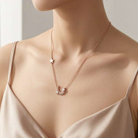 Moon and Star Cubic Zirconia Necklace in Rosegold with delicate celestial pendant and adjustable chain