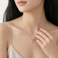 Cubic Zirconia celestial pendant necklace with moveable slider rings and rhodium plated finish