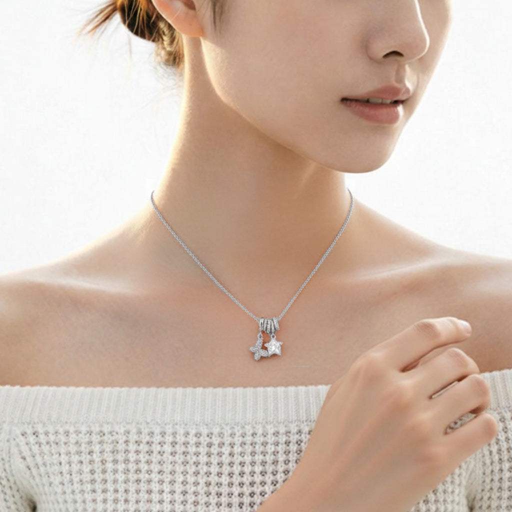 Cubic Zirconia butterfly pendant necklace with star charm and adjustable slider rings on rhodium plated chain