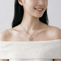 Rosegold flower necklace with spinning cubic zirconia pendant on delicate chain