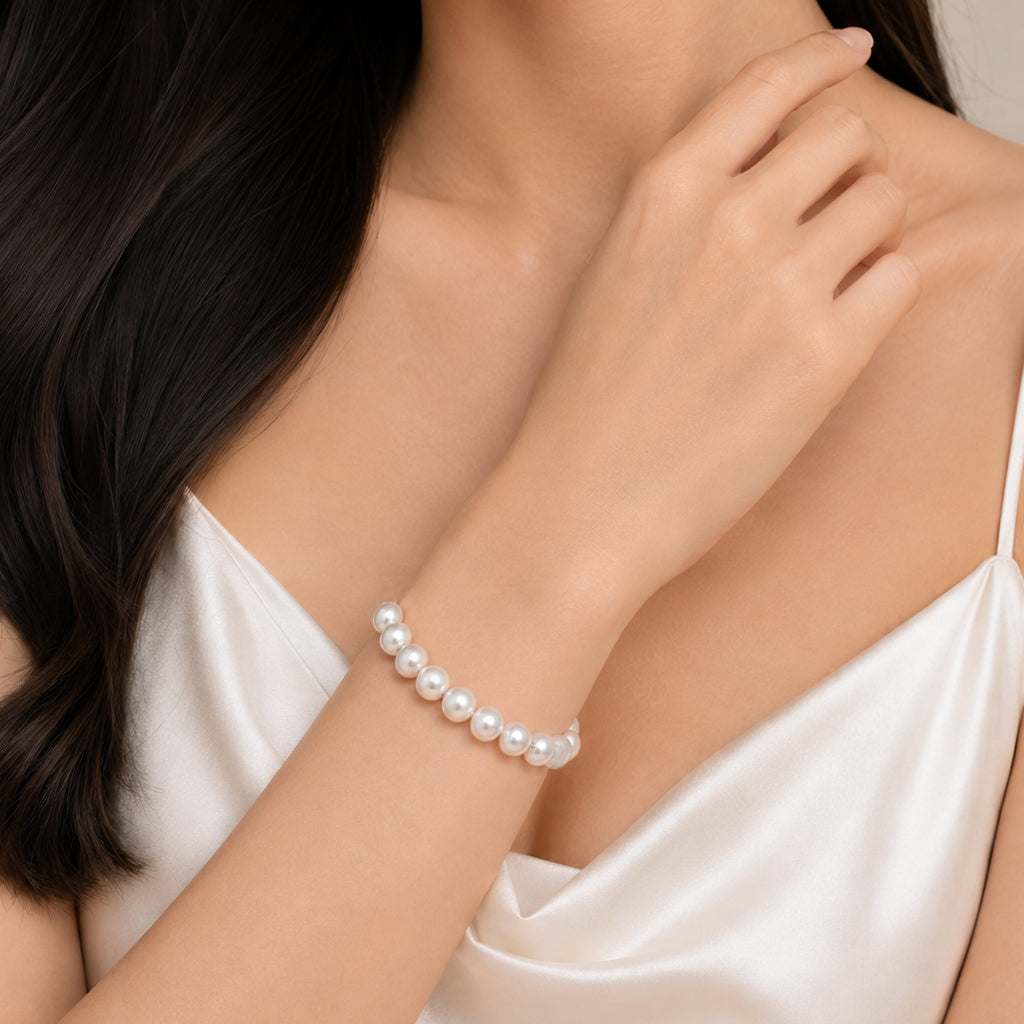 Simulated pearl elastic bracelet with 10mm pearls on a stretchable band for elegant everyday wear