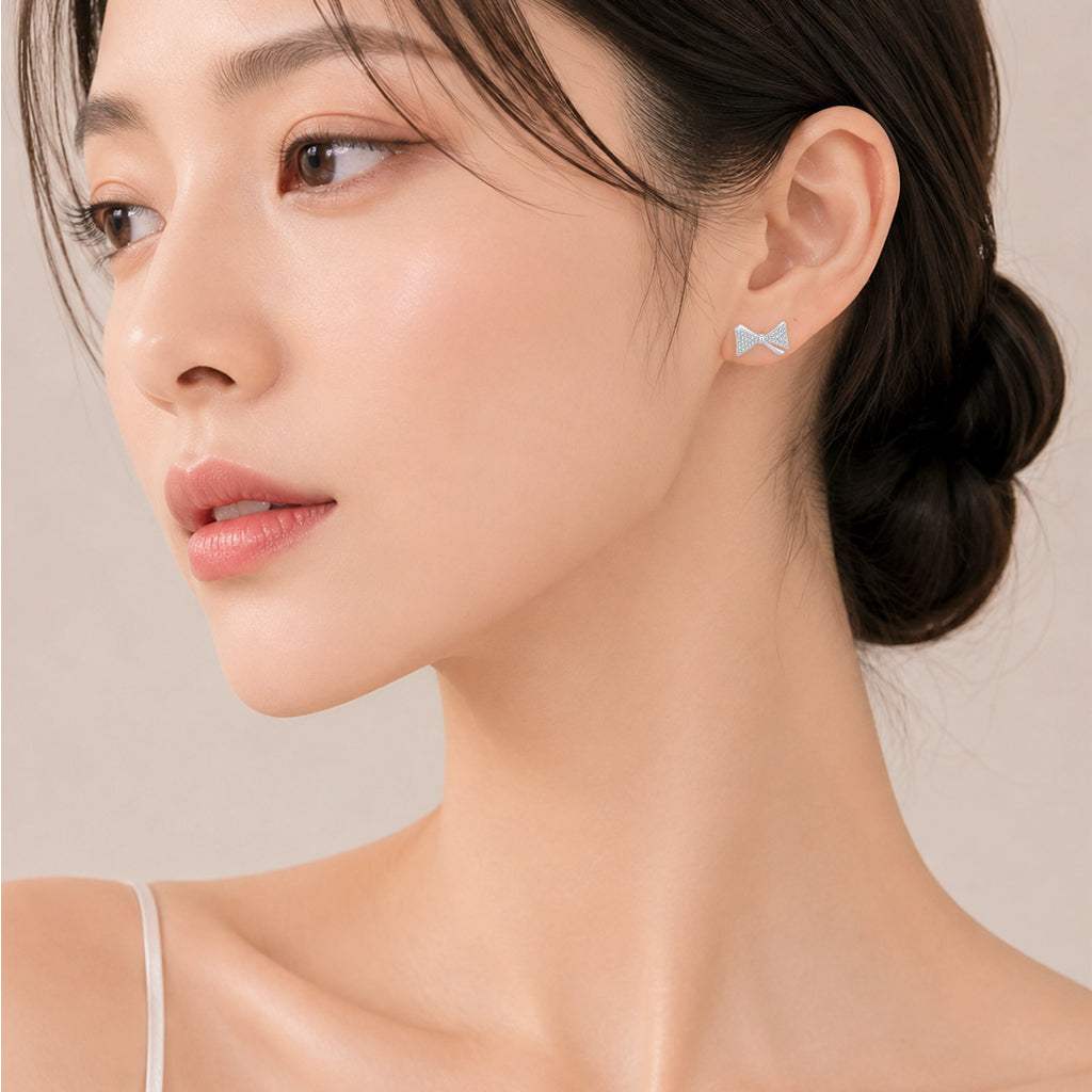 Elegant ribbon cubic zirconia stud earrings with rhodium plating and 925 posts