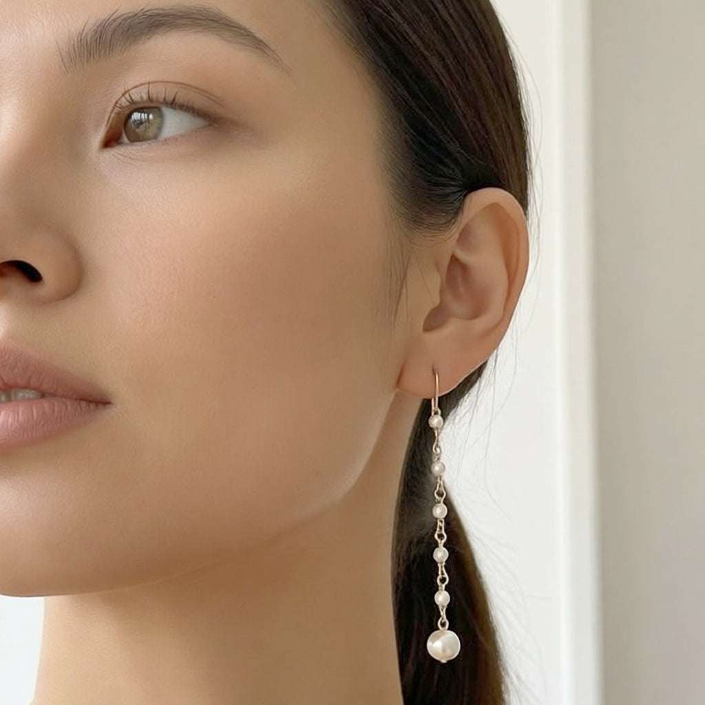 Elegant freshwater pearl earrings with gold plated hooks and long dangling pearls