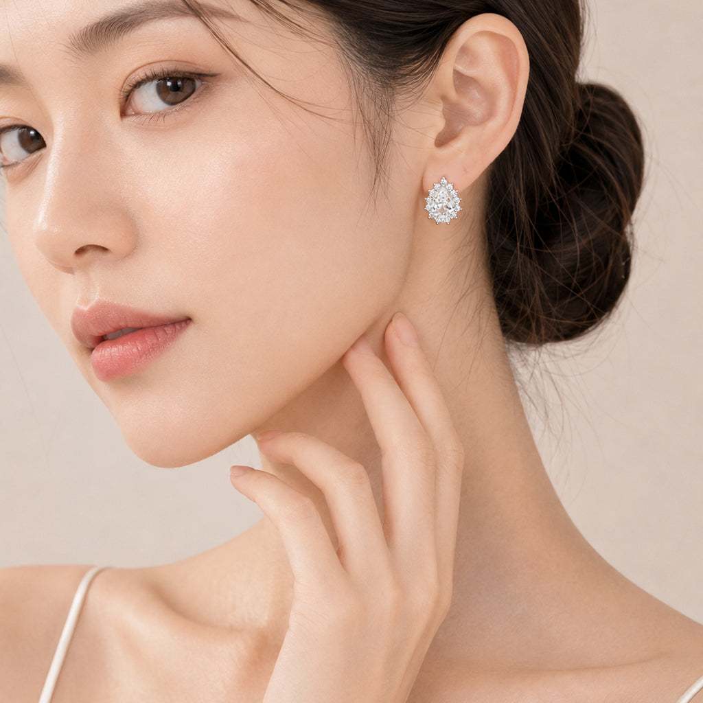 Cubic Zirconia hoop earrings with teardrop shape and rhodium plated finish