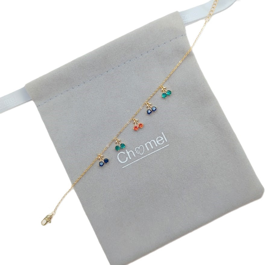 Gold-plated cubic zirconia tennis bracelet with dangling colorful cherry charms