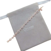 Rosegold plated cubic zirconia tennis bracelet with oval moonstones and small stone border, 16 cm length