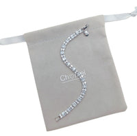 Cubic Zirconia Tennis Bracelet in silver-tone metal with sparkling baguette-cut stones and curved design
