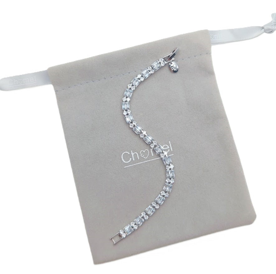 Cubic Zirconia Tennis Bracelet in silver-tone metal with sparkling baguette-cut stones and curved design