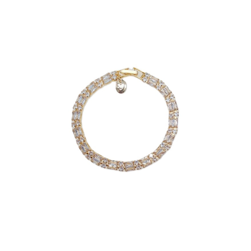 Cubic Zirconia Tennis Bracelet in gold plated metal with clear baguette-cut stones and a lobster clasp