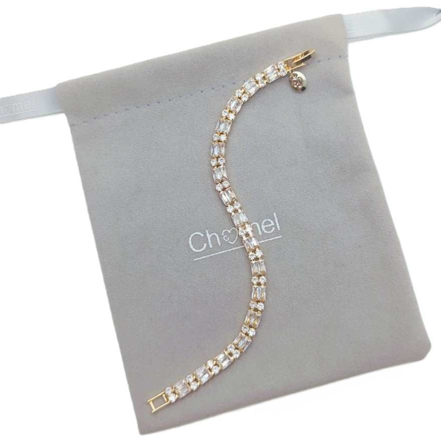 Cubic Zirconia Tennis Bracelet with gold-toned baguette-cut stones and a secure clasp detail